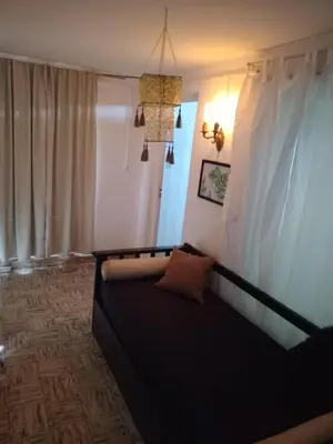 a living room with a couch and a window at Casa centrica in Villa Carlos Paz