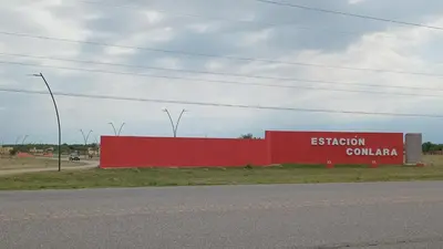 a red sign on the side of a road at La Puntana 