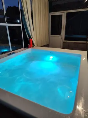 a large blue bath tub in a room at Alojamiento Nory's in Villa Carlos Paz