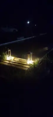 a room with lights on the tracks at night at Cabaña Eluney in Villa Ciudad Parque