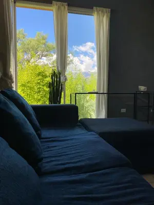 a bedroom with a bed and a large window at Las estrellas in Las Tapias