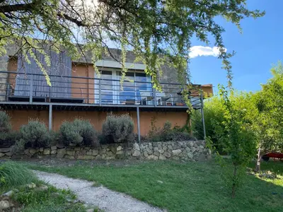 a house with a balcony on the side of it at Las estrellas in Las Tapias