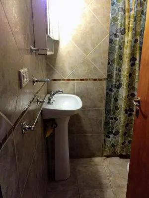 a bathroom with a sink and a shower at Rincón Soñado in Las Rabonas