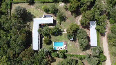 an aerial view of a house with a swimming pool at Posada La Rosita - Casa in Santa Rosa de Calamuchita