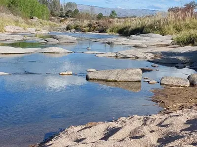 a river with rocks in the middle of it at Guathemoc cabañas in Panaholma