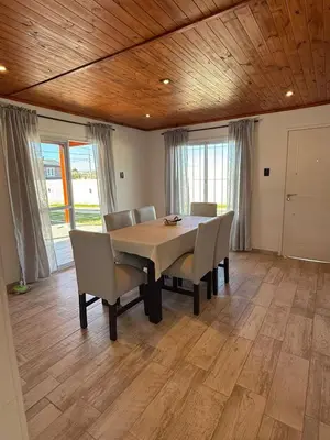 a dining room with a table and chairs at Los Pinos in Achiras