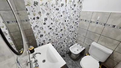 a small bathroom with a toilet and a sink at Complejo Ebenezer in San Ignacio