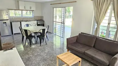 a living room with a couch and a table at Complejo Ebenezer in San Ignacio