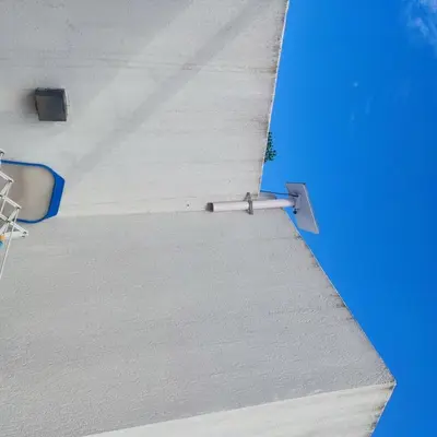 a view of the side of a building with a white roof at Casa Minimalista con Pileta Privada en el mejor lugar de Cabalango in Cavalango