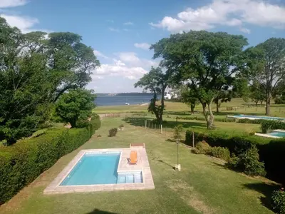 an overhead view of a swimming pool in a garden at Casa La Escondida in Villa del Dique