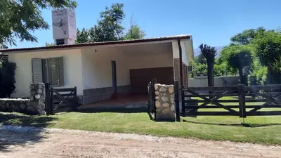 a house with a wooden gate in front of it at Casa en Nono in Nono