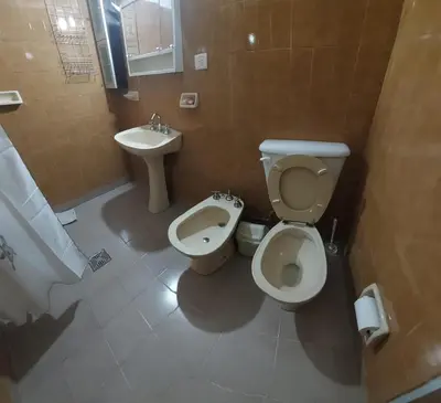 a bathroom with a toilet and a bidet and a sink at Casa en Nono in Nono
