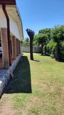 a yard next to a house with a tree at Casa en Nono in Nono