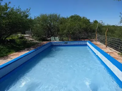a swimming pool with blue water in it at Valle Iguana in San Lorenzo