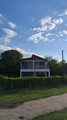 a house with a fence in front of it at Lo de Abu in Villa de Las Rosas
