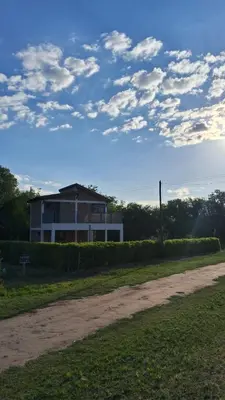 a house on the side of a dirt road at Lo de Abu in Villa de Las Rosas