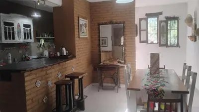 a kitchen and dining room with a table and chairs at CASA SAMARANA Alta Gracia in Alta Gracia