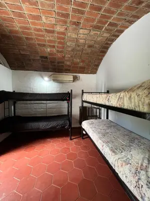two bunk beds in a room with a red floor at Departamento en Villa Carlos paz in Villa Carlos Paz