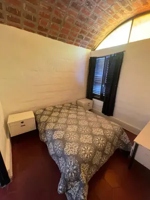 a bedroom with a bed in a room with a window at Departamento en Villa Carlos paz in Villa Carlos Paz