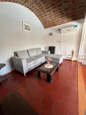 a living room with a couch and a table at Departamento en Villa Carlos paz in Villa Carlos Paz