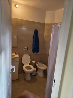 a bathroom with a toilet and a sink at Quique1 in Pilar