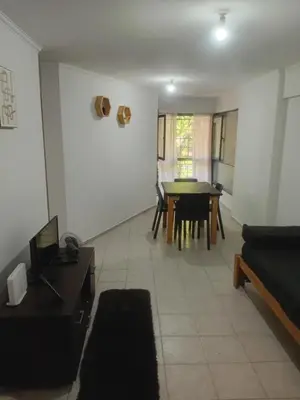 a living room with a table and a couch at Nueva Córdoba primer piso Externo in Cordoba