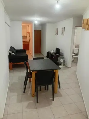 a dining room and living room with a table and chairs at Nueva Córdoba primer piso Externo in Cordoba