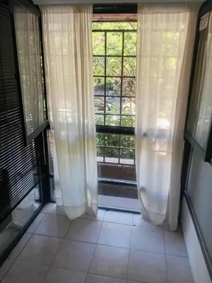 a room with a window with white curtains at Nueva Córdoba primer piso Externo in Cordoba