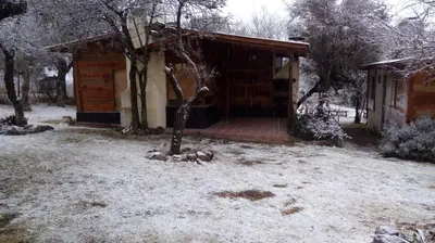 a house with snow on the ground in front of it at Alto de Balcón in Tanti