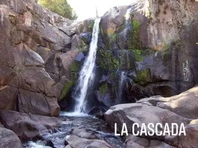 a waterfall on the side of a rocky mountain at Alto de Balcón in Tanti