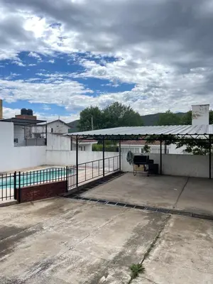 a pavilion with a piano on top of a building at Areté Del Rio in Villa Carlos Paz