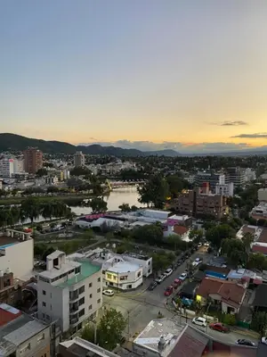 an aerial view of a city at sunset at DEPARTAMENTO con PILETA CENTRO CARLOS PAZ in Villa Carlos Paz