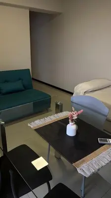 a living room with a couch and a table with a couch at DEPARTAMENTO con PILETA CENTRO CARLOS PAZ in Villa Carlos Paz