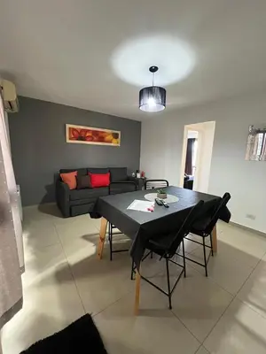 a living room with a table and a couch at Ruptura in Villa Carlos Paz