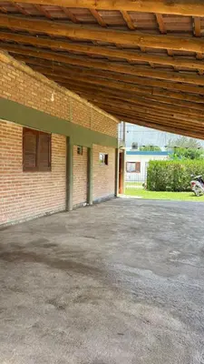 an empty parking lot in front of a brick building at Departamento Vilma Planta Alta Brochero in Villa Cura Brochero
