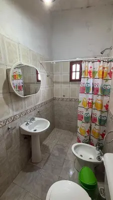 a bathroom with a toilet and a sink at Departamento Vilma Planta Alta Brochero in Villa Cura Brochero