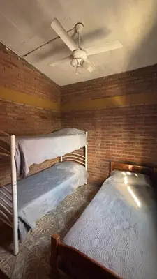 two bunk beds in a room with a ceiling fan at Departamento Vilma Planta Alta Brochero in Villa Cura Brochero