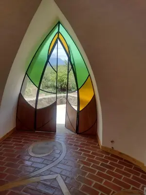 an empty room with a large stained glass window at Cabañas Las Luciérnagas in San Javier