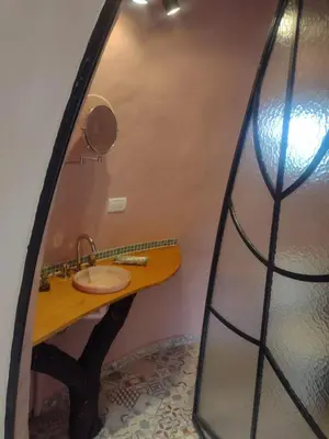 a bathroom with a sink and a mirror at Cabañas Las Luciérnagas in San Javier