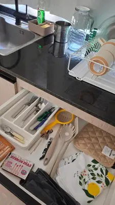 a kitchen drawer filled with lots of kitchen utensils at Hermosa Casa Moderna en el Mirador del Lago in Bialet Massé