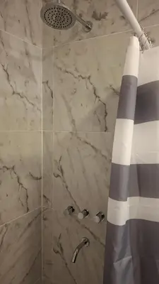 a bathroom with a shower with a glass door at Hermosa Casa Moderna en el Mirador del Lago in Bialet Massé