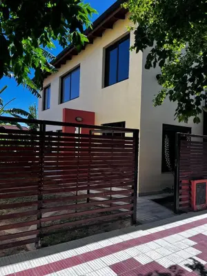 a house with a fence in front of it at Shakti in Almafuerte
