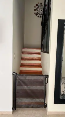a stairway with a wooden railing and a stair case at Shakti in Almafuerte