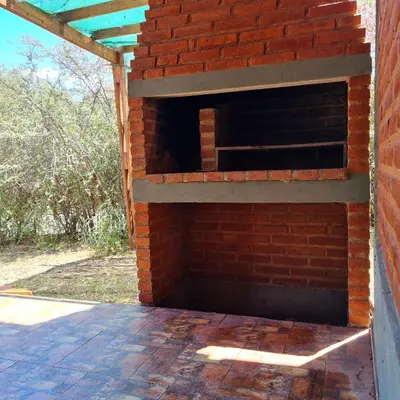 an outdoor brick oven on the side of a building at Complejo Ayllu in Las Rabonas