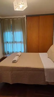 a bed with a towel on it in a bedroom at CBA Apart in Cordoba