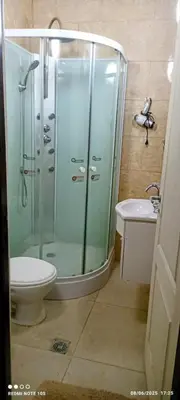 a bathroom with a shower and a toilet and a sink at Nuevos Aires in Los Reartes