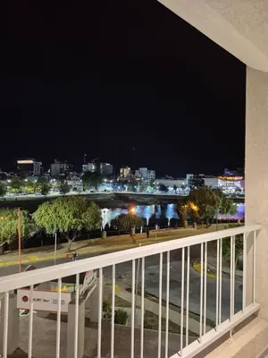 a view of a city at night from a balcony at ALOJATE PREMIUM VILLA CARL0S PAZ - STEFANO 1 dor in Villa Carlos Paz