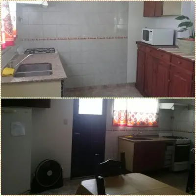 a kitchen with a sink and a stove top oven at Cactus in Villa Carlos Paz
