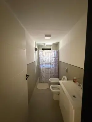 a small bathroom with a toilet and a sink at Monoambiente Cañitas in Malagueño