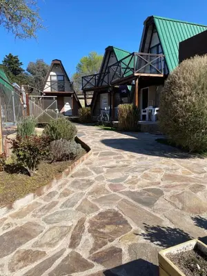 a stone walkway in front of a house at Complejo alpinas del valle in Santa Rosa de Calamuchita